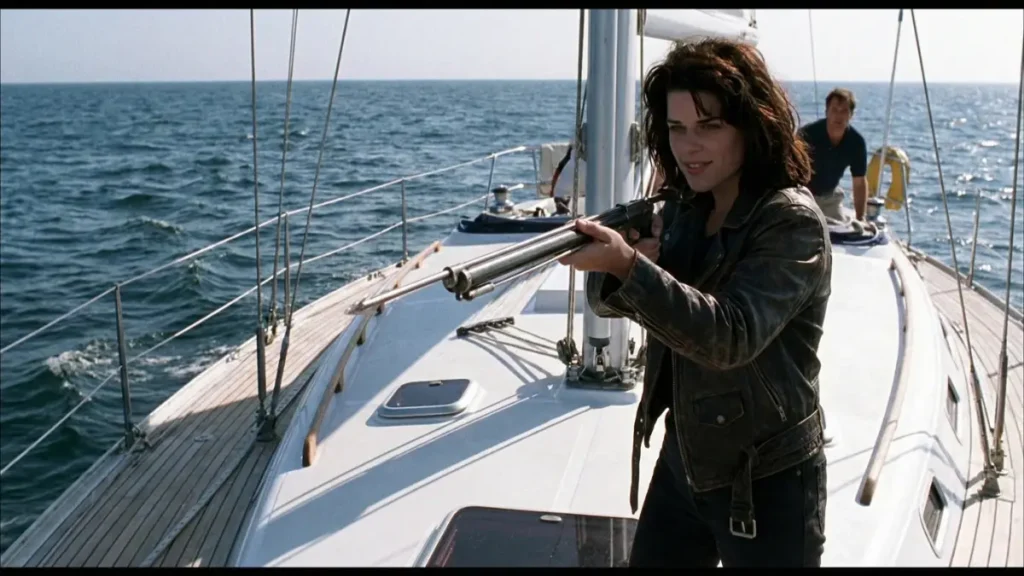 Suzie Toller revealing herself alive and holding a spear gun on the boat in the Wild Things ending.